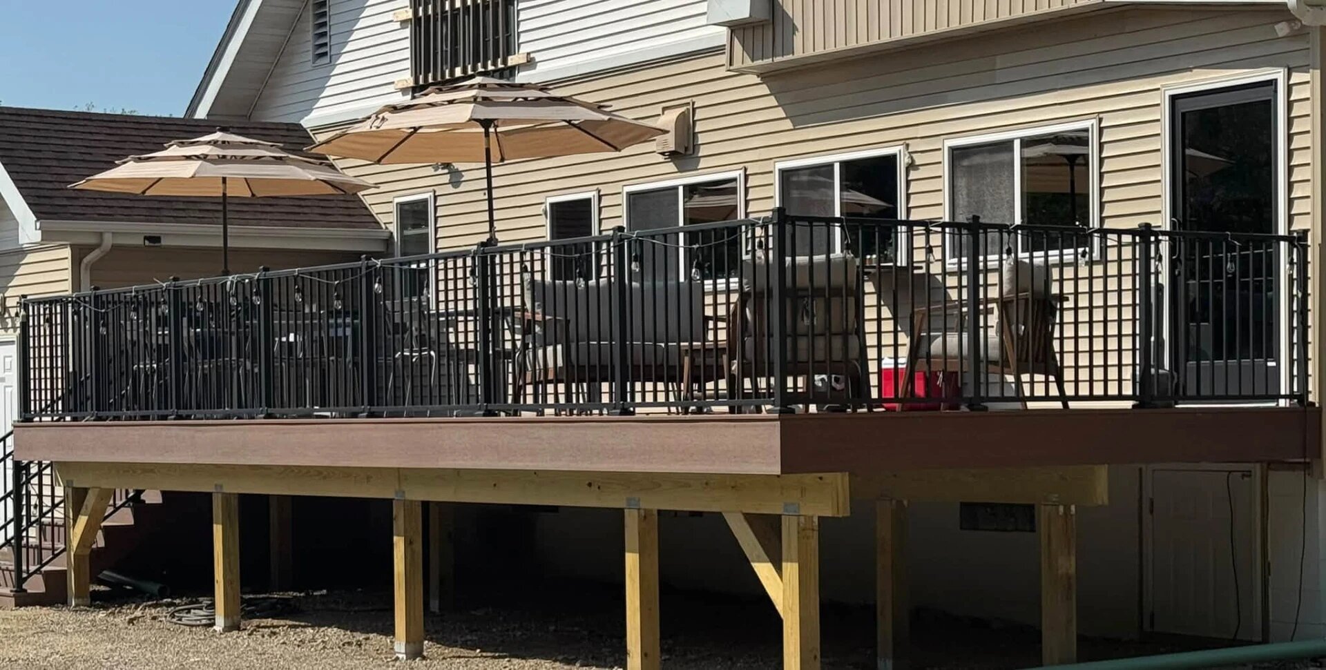 The Sandpiper Inn back deck with umbrellas and string lights